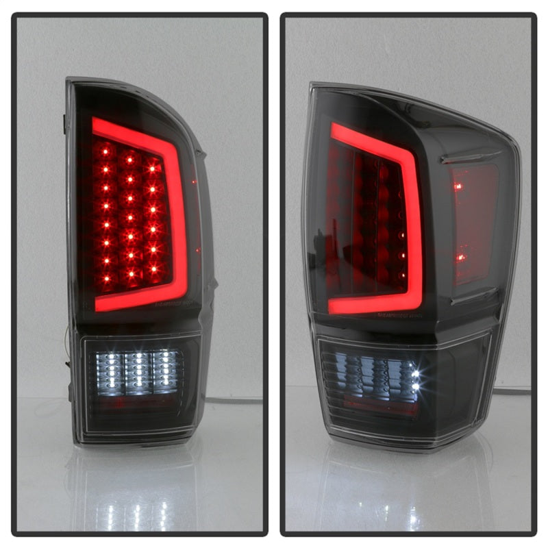 xTune 16-18 Toyota Tacoma Light Bar LED Tail Lights - Black Smoked (ALT-JH-TTA16-LBLED-BSM)