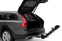 Load image into Gallery viewer, Thule Apex XT 4 - Hanging Hitch Bike Rack w/HitchSwitch Tilt-Down (Up to 4 Bikes) - Black